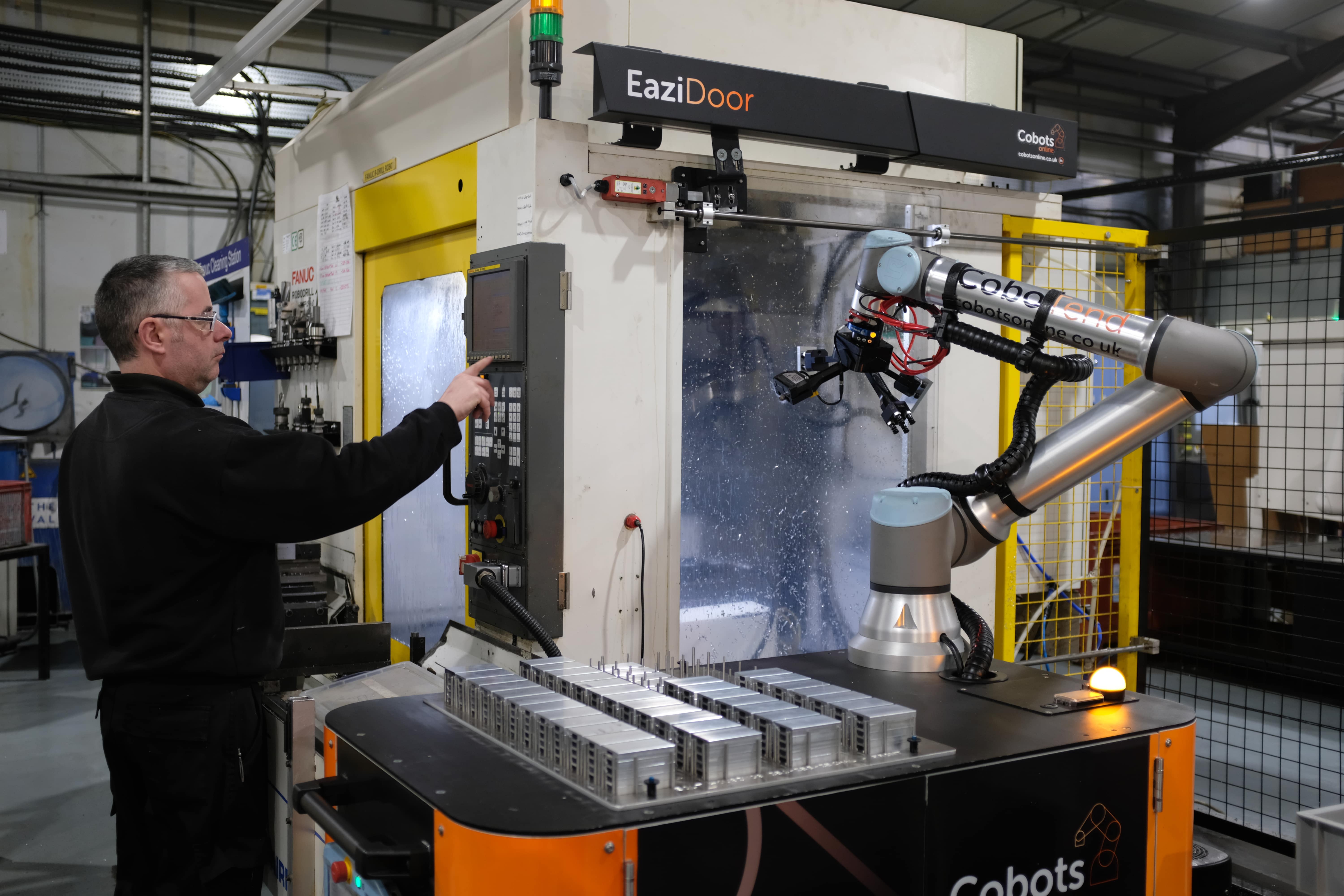 Worker working alongside cobot, CoboTend